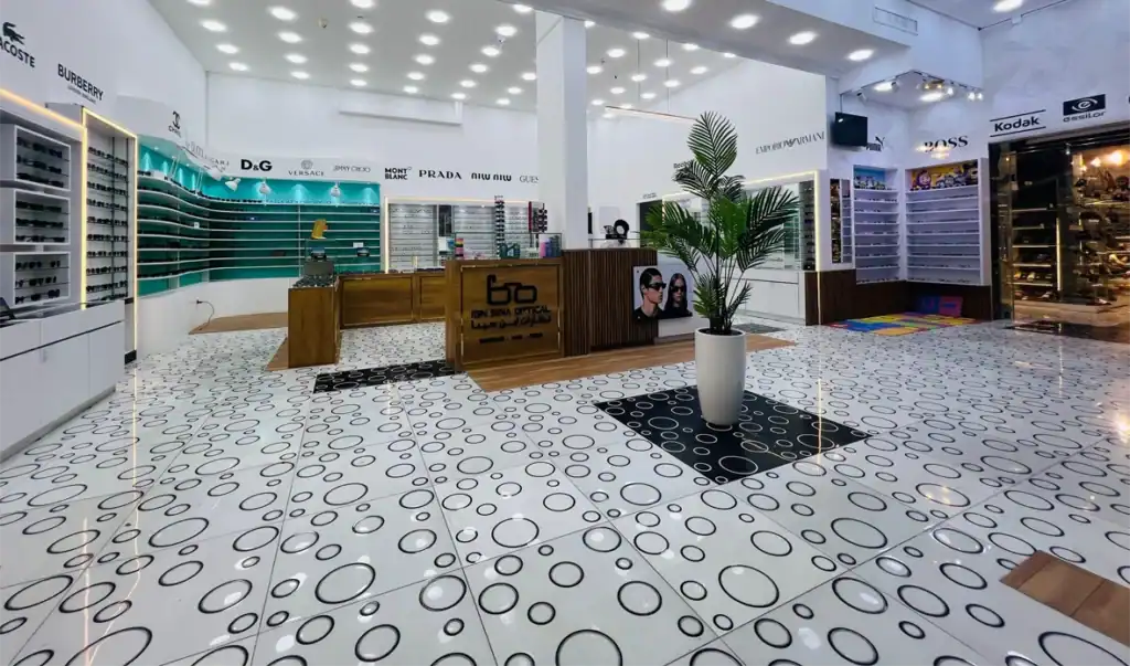 Bright optical shop with brand-name sunglasses and eyeglasses displays.